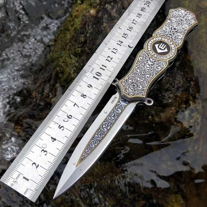 professional-stainless-steel-camping-pocket-knife-with3d-pattern-aluminum-handle_64355ce953a89.jpeg Fidget Spinner Folding Knife - Image 1